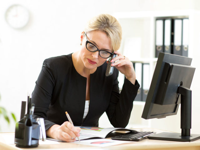 Woman working and talking on the phone